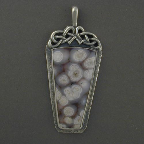 This unusual jasper knot work pendant is done in soothing greys and white reminiscent of constellations or sea creatures. Let this pendant enhance your life today.