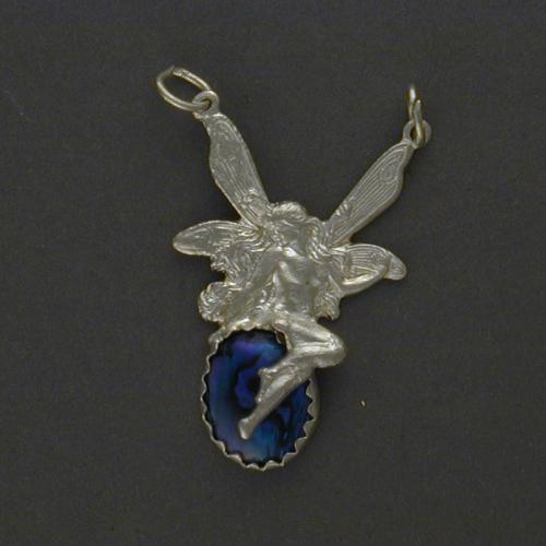 This is a small version of our Fairy Pool pendant done with blue paua shell.