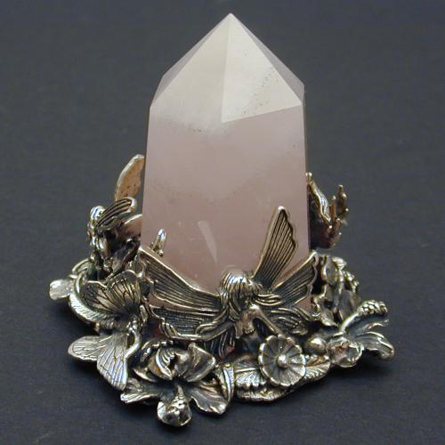 Fairies and butterflies dance around this pink quartz point in a celebration of the coming Spring Season.